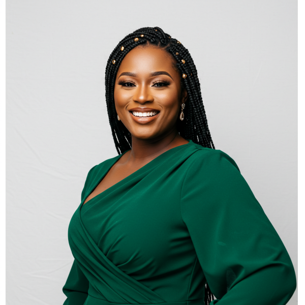 A pretty black woman in a green dress smiling #4