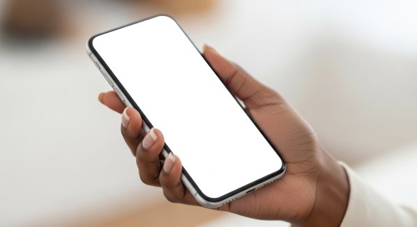 A black person's hand holding a phone mockup #1